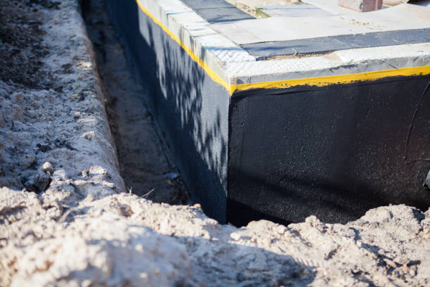 Professional Waterproofing technician working in Medina, WA